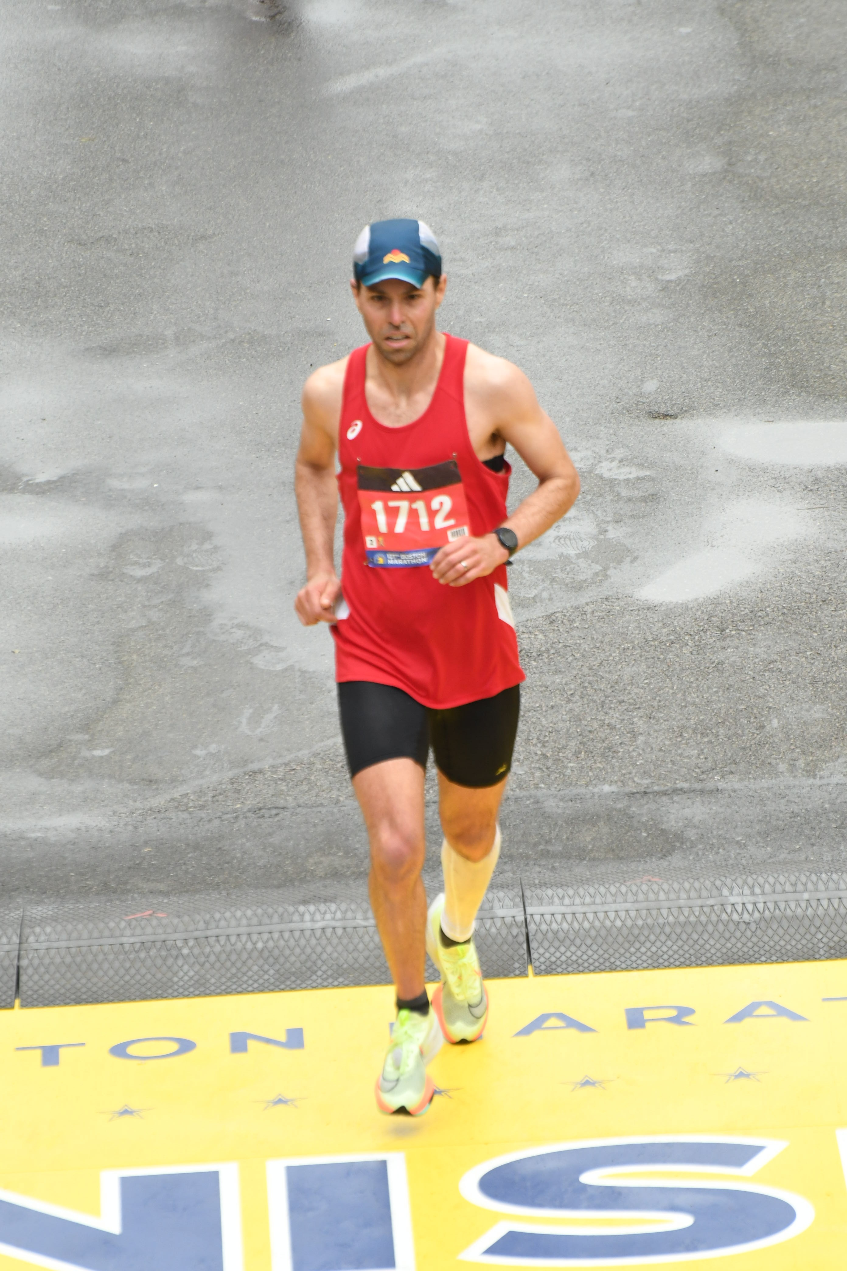 Pace Perfect Coach Neil Davis running on a track